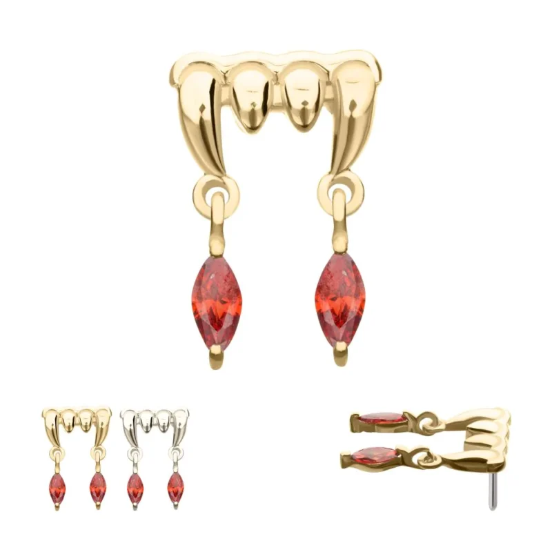 The 14K Dripping Fangs & Marquise Dangle earrings feature two red marquise gemstones. Images show gold and silver options and a close-up side view.