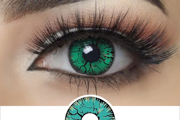 A close-up of an eye wearing Magister - Green Crack contacts, showing a black vein-like pattern, long lashes, and bold brows. Below is a graphic detail of the same striking contact lens design.