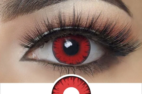A close-up of an eye with bold makeup and long lashes showcases Magister - Red Twilight Volturi contacts with a black outer ring. Below, the striking Magister - Red Twilight Volturi lens design is shown separately on a white background.