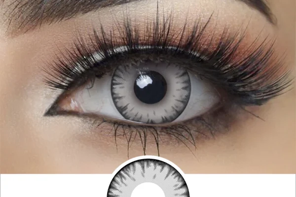 A close-up shows a dramatic eye with bold makeup, long false lashes, and a Magister - Light Gray Vampire contact lens with a dark outer ring and radial pattern. Below the eye, a single Magister - Light Gray Vampire lens is displayed.