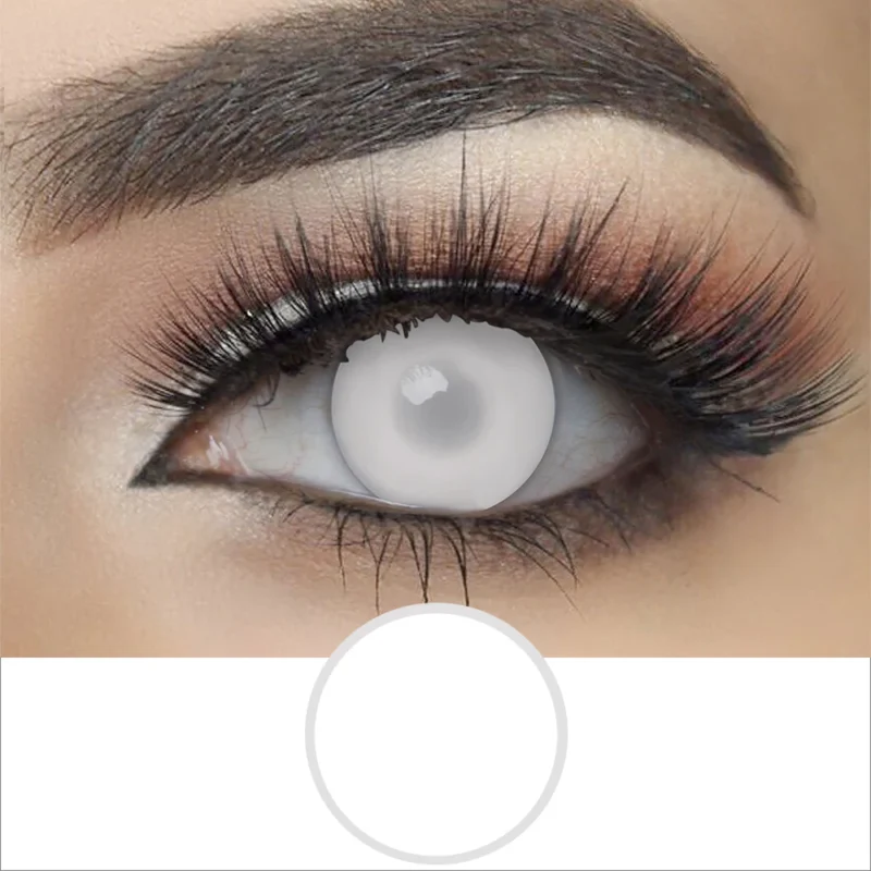 A close-up of an eye with dramatic makeup and long false lashes, wearing Magister- Blind White contacts that are light gray, almost white, fully covering the iris and pupil.