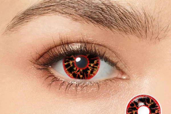 A close-up of an eye wearing Magister - Red Vein contacts, showcasing a bold black and red fiery pattern. An inset displays a detailed view of the lens design labeled MY34.