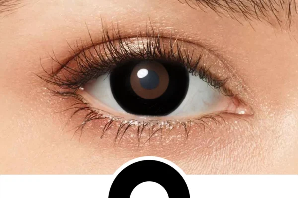 A close-up of a human eye with a large black circle beneath it on a white background highlights the shape similarity between the pupil and EYECON Black Out, evoking its unique visual effect.