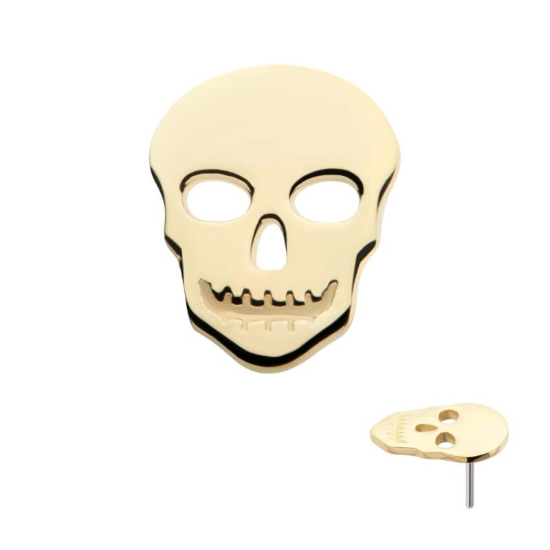 The 14K Skull Cut-Out earring features eye, nose, and mouth cutouts on a gold skull. A side view shows the post attached at the back.