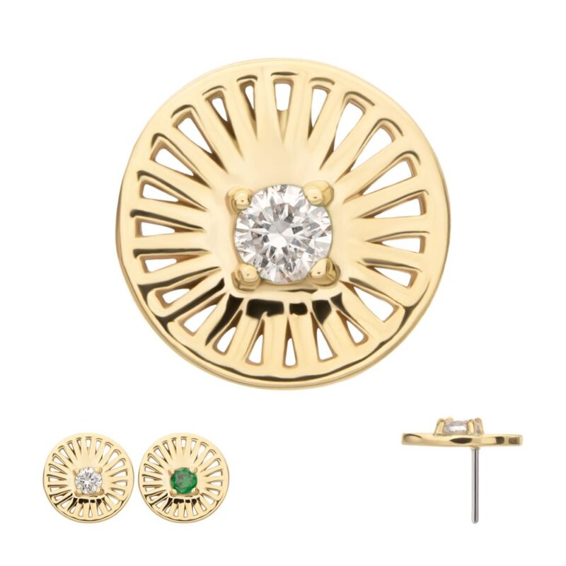 The 14K Radiant Circle with Gem earrings feature a sunburst gold design with central gems—one clear diamond, one green stone. Side view displays the post and gemstone setting.