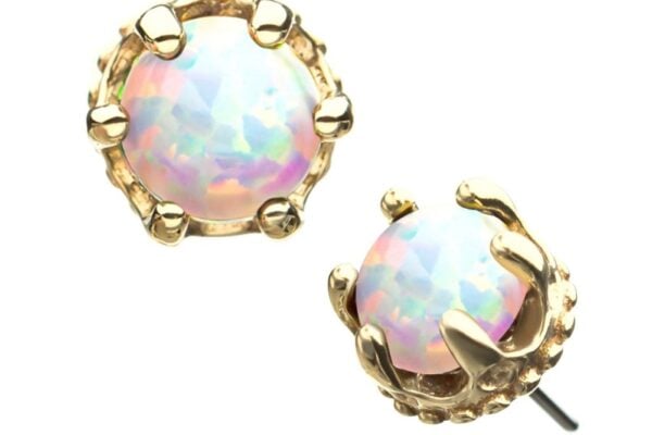 Close-up of the 14K Crown Set Opal earrings—round opal studs with iridescent surfaces, set in elegant gold-tone claw-like prongs for a delicate appearance.