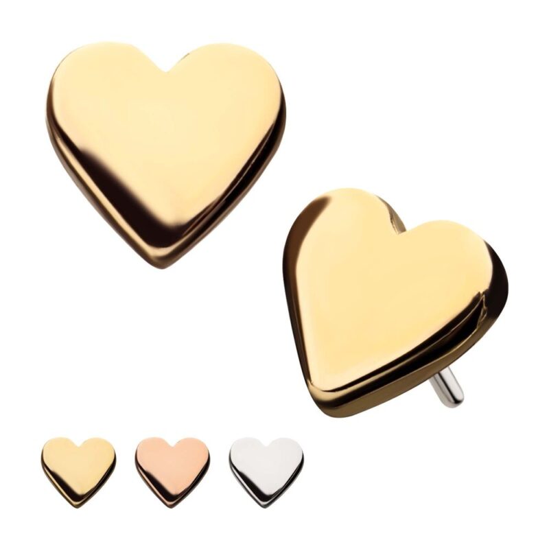 Four 14K Heart Shape metal studs in gold, rose gold, silver, and white finishes are displayed on a white background. The gold stud is shown larger and positioned to highlight both its side and front.