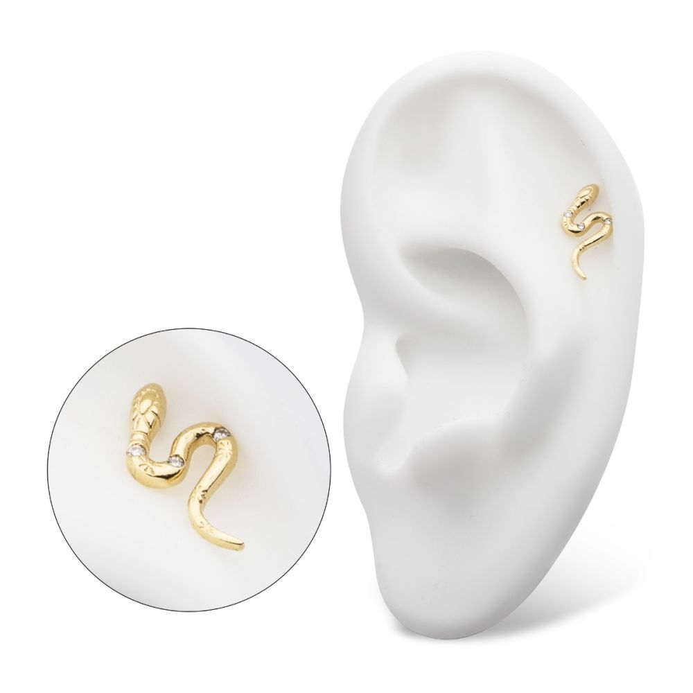 The 14K Snake – Gem earring is displayed on a white ear-shaped model, with a close-up inset highlighting the earring’s intricate details. The 14K Snake – Gem earring is displayed on a white ear-shaped model, with a close-up inset highlighting the earring’s intricate details.