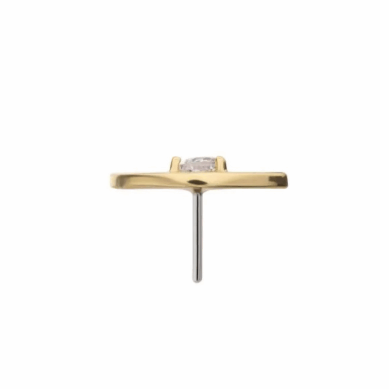 A minimalist gold earring stud with a flat, rectangular design and a single clear gemstone in the center, shown from the side against a plain white background.