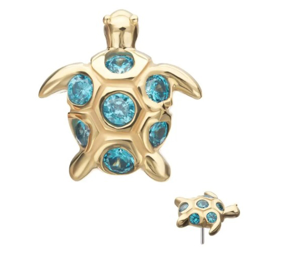 A gold turtle-shaped earring with five blue gemstones set in its shell, shown from the front and side.