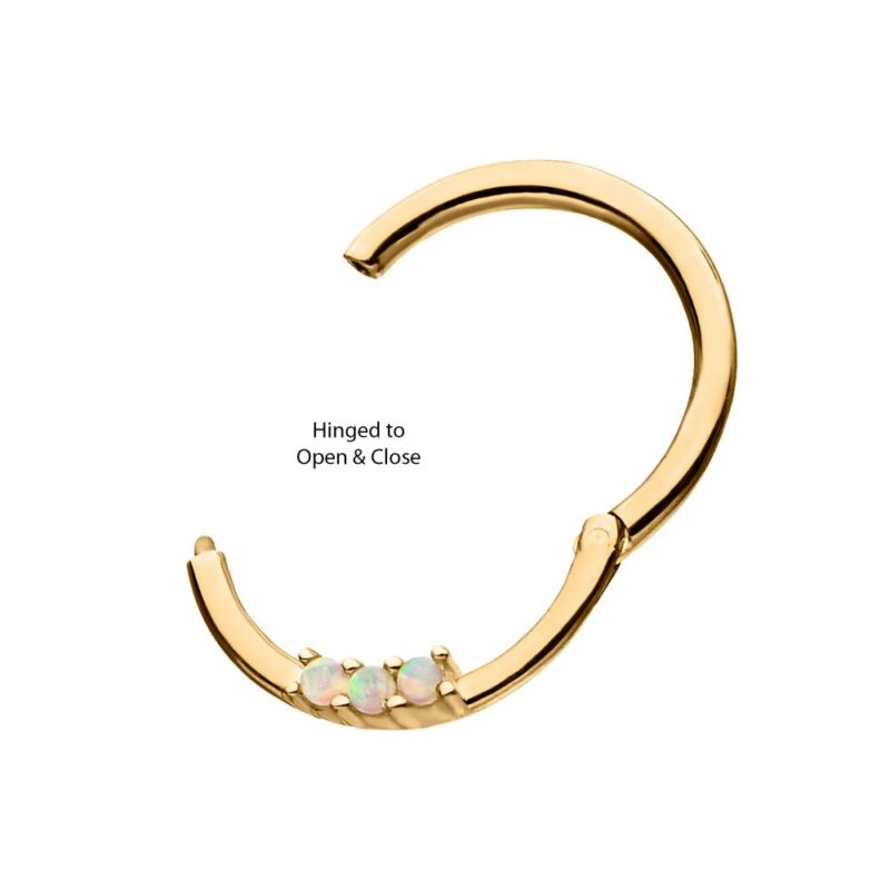 A gold hoop earring with a hinged opening, featuring three small iridescent stones set along the bottom. The earring is open, and text reads Hinged to Open & Close.