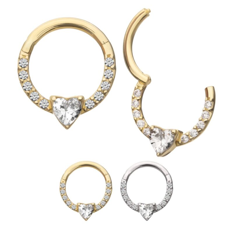 The 14K Heart Clicker set includes four hoop earrings with heart-shaped gemstones and round crystals: two gold, one rose gold, and one silver. One gold hoop is open to reveal the clasp.