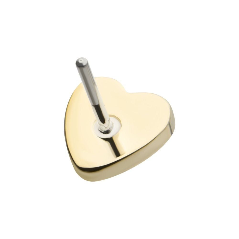 The 14K Heart – Hammered features a gold heart-shaped base with a vertical silver rod at its center, shown against a white background. The 14K Heart – Hammered features a gold heart-shaped base with a vertical silver rod at its center, shown against a white background.