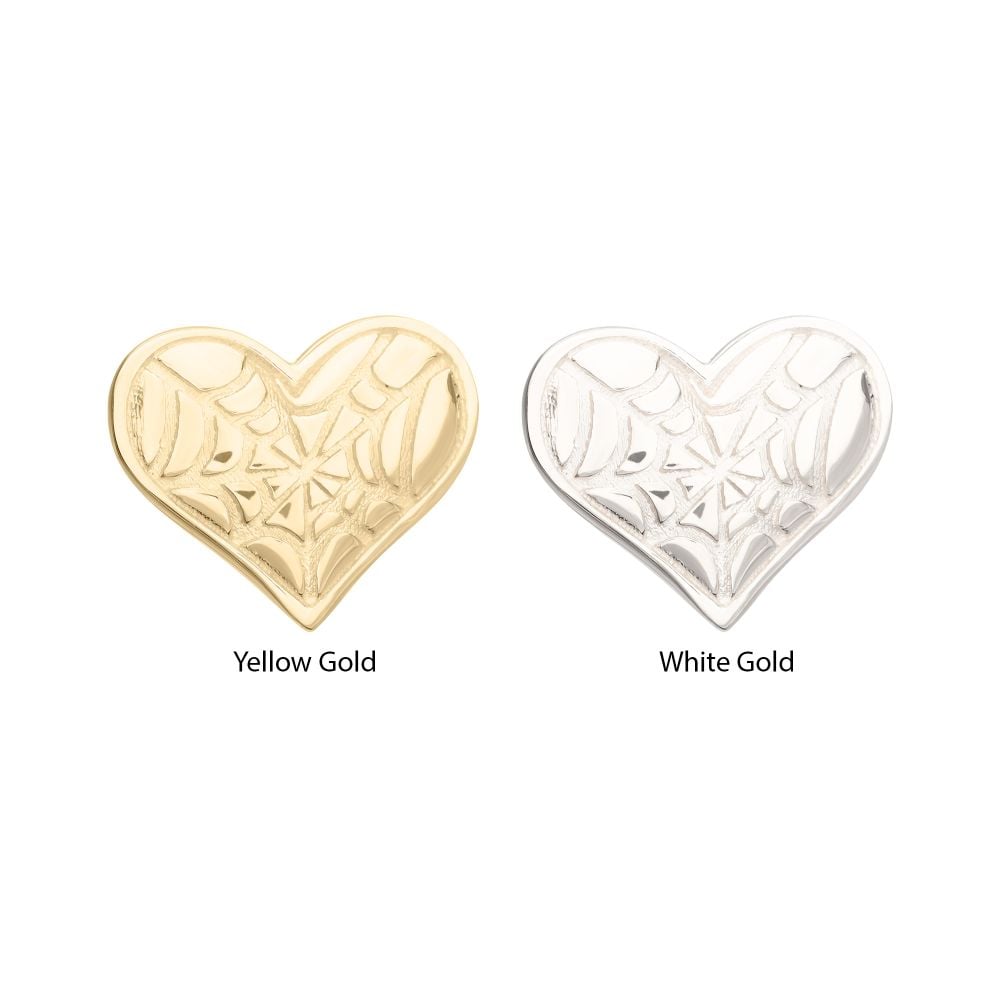 Two 14K Spiderweb Carved Heart charms are displayed side by side—one in yellow gold, labeled Yellow Gold, and one in white gold, labeled White Gold—both featuring engraved spiderweb designs. Two 14K Spiderweb Carved Heart charms are displayed side by side—one in yellow gold, labeled Yellow Gold, and one in white gold, labeled White Gold—both featuring engraved spiderweb designs.