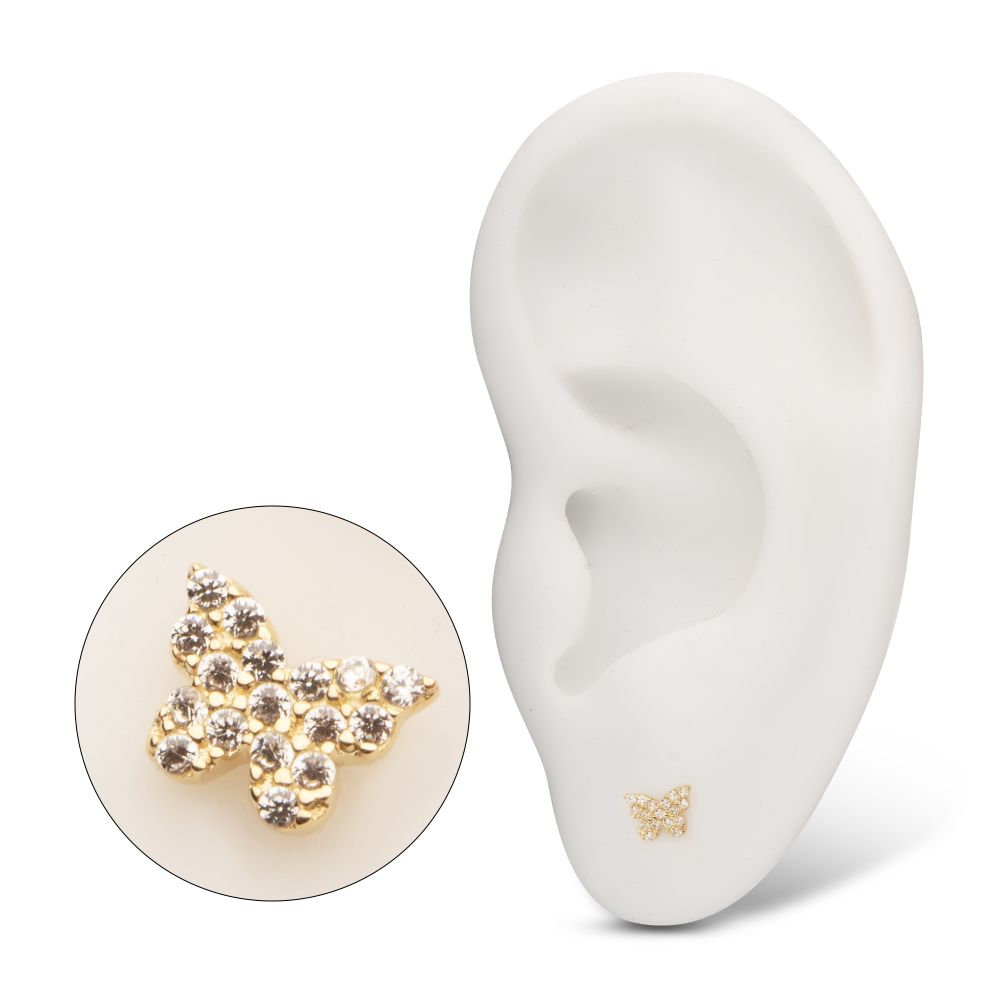 A gold butterfly-shaped stud earring with small clear gemstones, displayed on a white ear model. An enlarged inset shows the detailed design of the butterfly stud. A gold butterfly-shaped stud earring with small clear gemstones, displayed on a white ear model. An enlarged inset shows the detailed design of the butterfly stud.