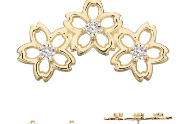 The 14K Cherry Blossom Cluster earring features three connected cherry blossom flowers with clear gemstone centers. Additional images display the earring from the front, side, and at an angle to showcase its design details.