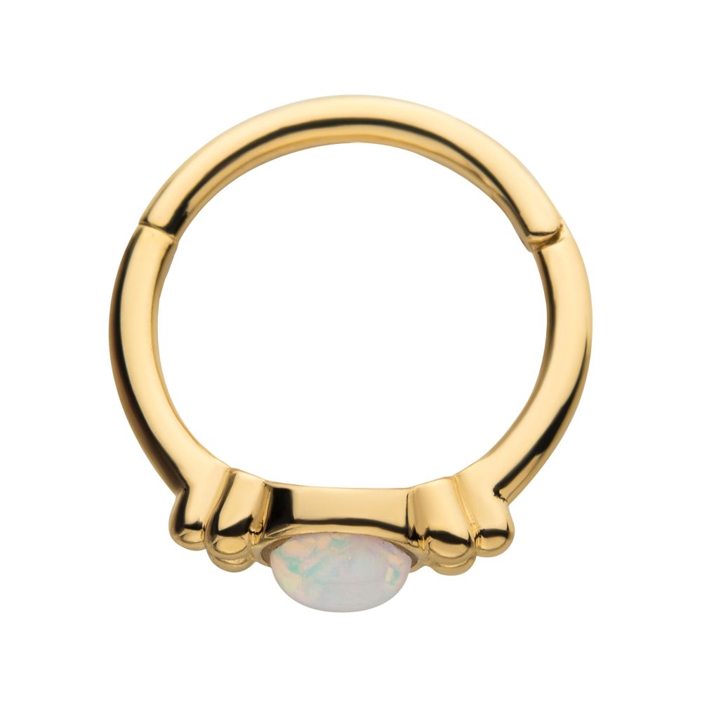 The 14K Full Moon Side Clicker is a gold ring with a smooth, round opal at the front and three small decorative bumps on each side of the stone. The 14K Full Moon Side Clicker is a gold ring with a smooth, round opal at the front and three small decorative bumps on each side of the stone.