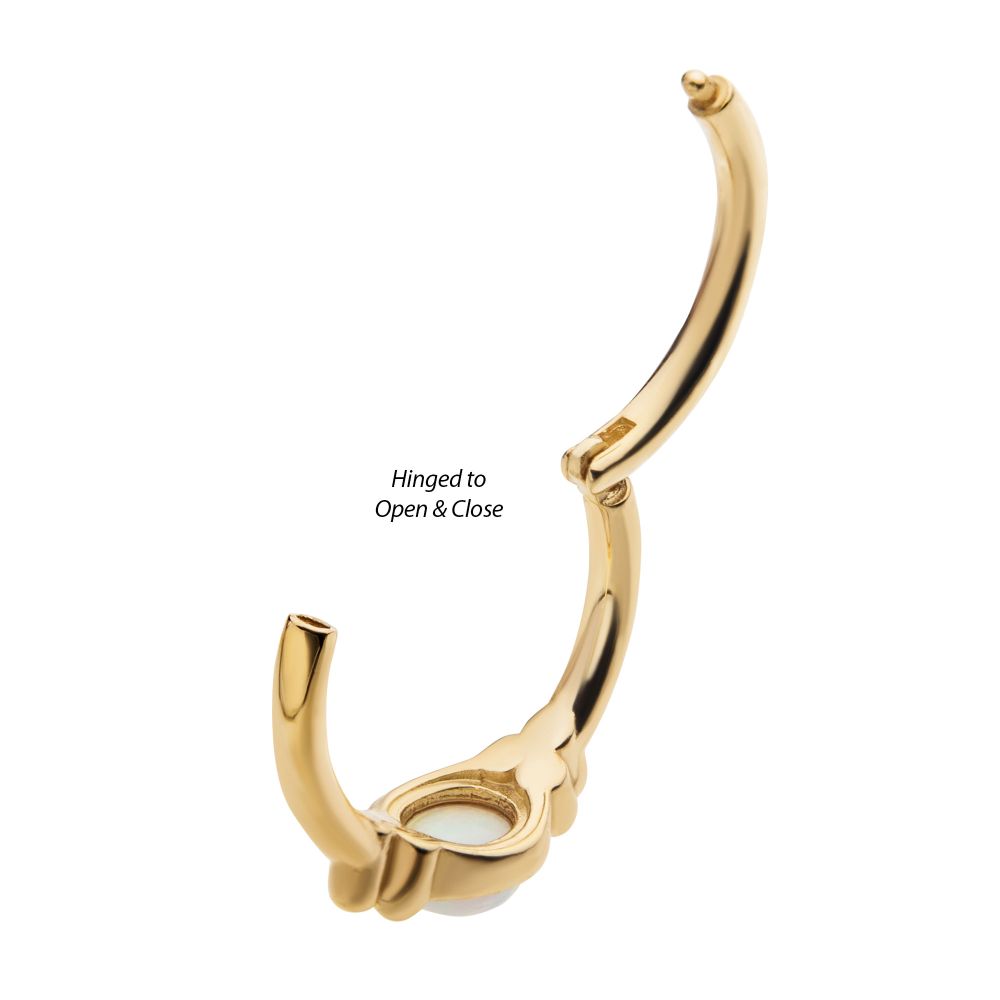 The 14K Full Moon Side Clicker nose ring is open, showing its clasp mechanism and a white accent at the center. Text reads: Hinged to Open & Close. The 14K Full Moon Side Clicker nose ring is open, showing its clasp mechanism and a white accent at the center. Text reads: Hinged to Open & Close.