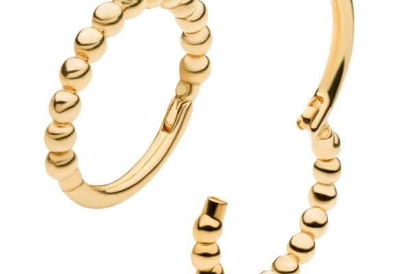 The 14K Bubble Clicker is a pair of gold hoop earrings with evenly spaced round beads along the front; one earring is open to display the clasp, while the other is closed.