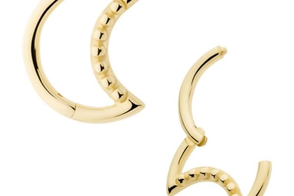 The 14K Crescent Moon Beaded Clicker features two gold crescent-shaped earrings—one open, one closed—with a row of small round beads accenting the inner curve.