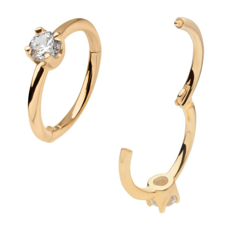 A 14K Proposal Clicker gold ring with a single round diamond is displayed next to a matching gold earring with a similar diamond setting, both set against a white background.