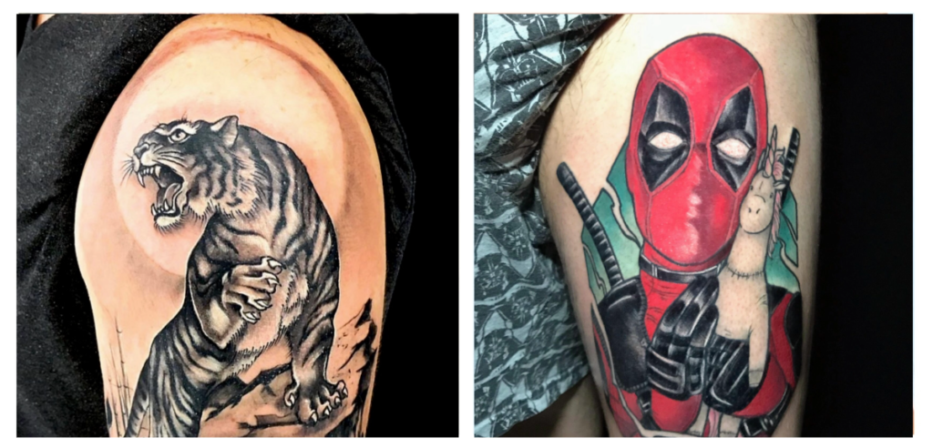 Side-by-side tattoos: left, a realistic roaring tiger in black and grey; right, a colorful cartoon-style Deadpool holding a small white llama, both on upper arms.