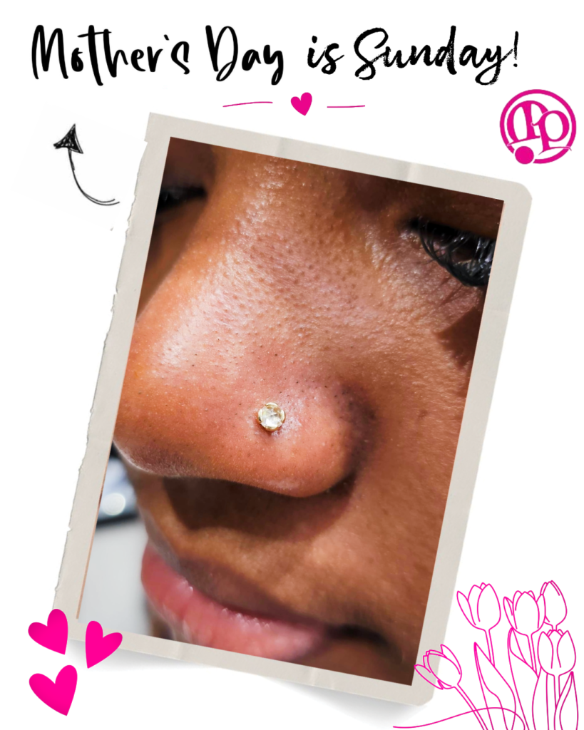 Close-up of a persons nose with a jeweled nose stud. Text at the top reads Mothers Day is Sunday! The image is decorated with hearts, flowers, and an arrow.